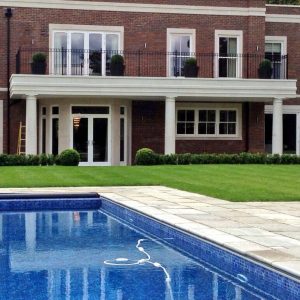 Rear view of a house with a private swimming pool.