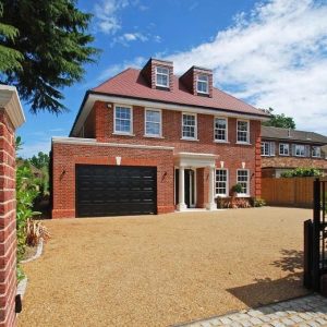 Family home with garage and stone portico